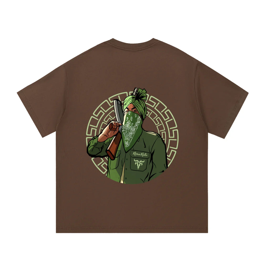 Brown oversized t-shirt with graphic of a masked man in green turban holding a bat