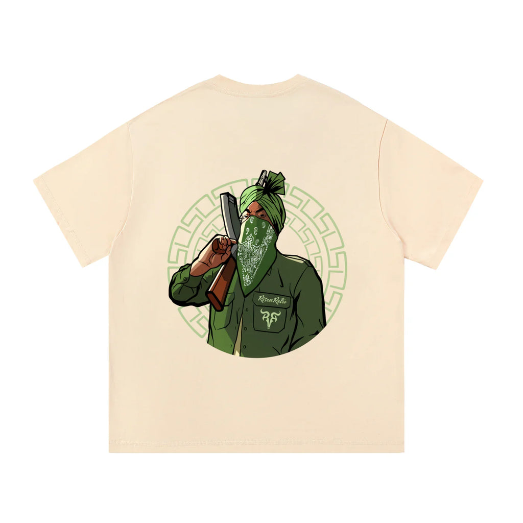 Oversized beige t-shirt with graphic of masked man in green turban holding a rifle