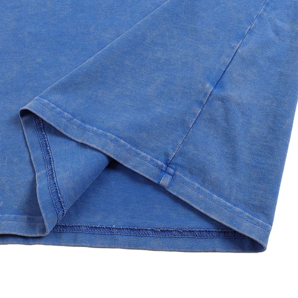 Close-up of a blue fabric with a slight texture on a white background