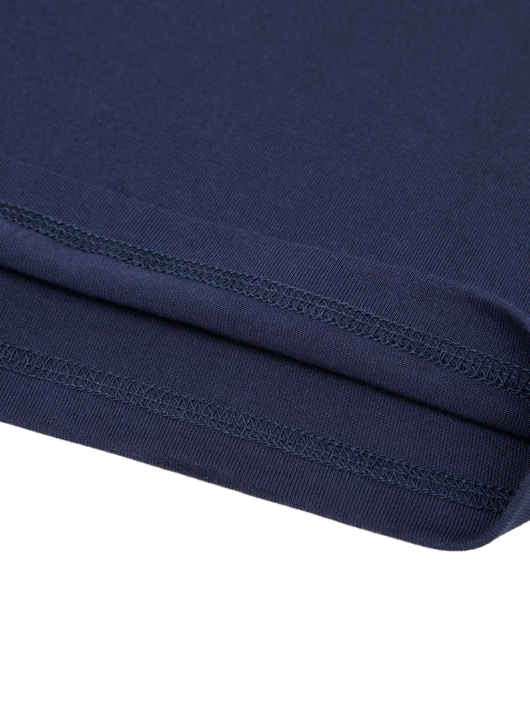 Close-up of navy blue heavyweight streetwear fabric with reinforced stitching