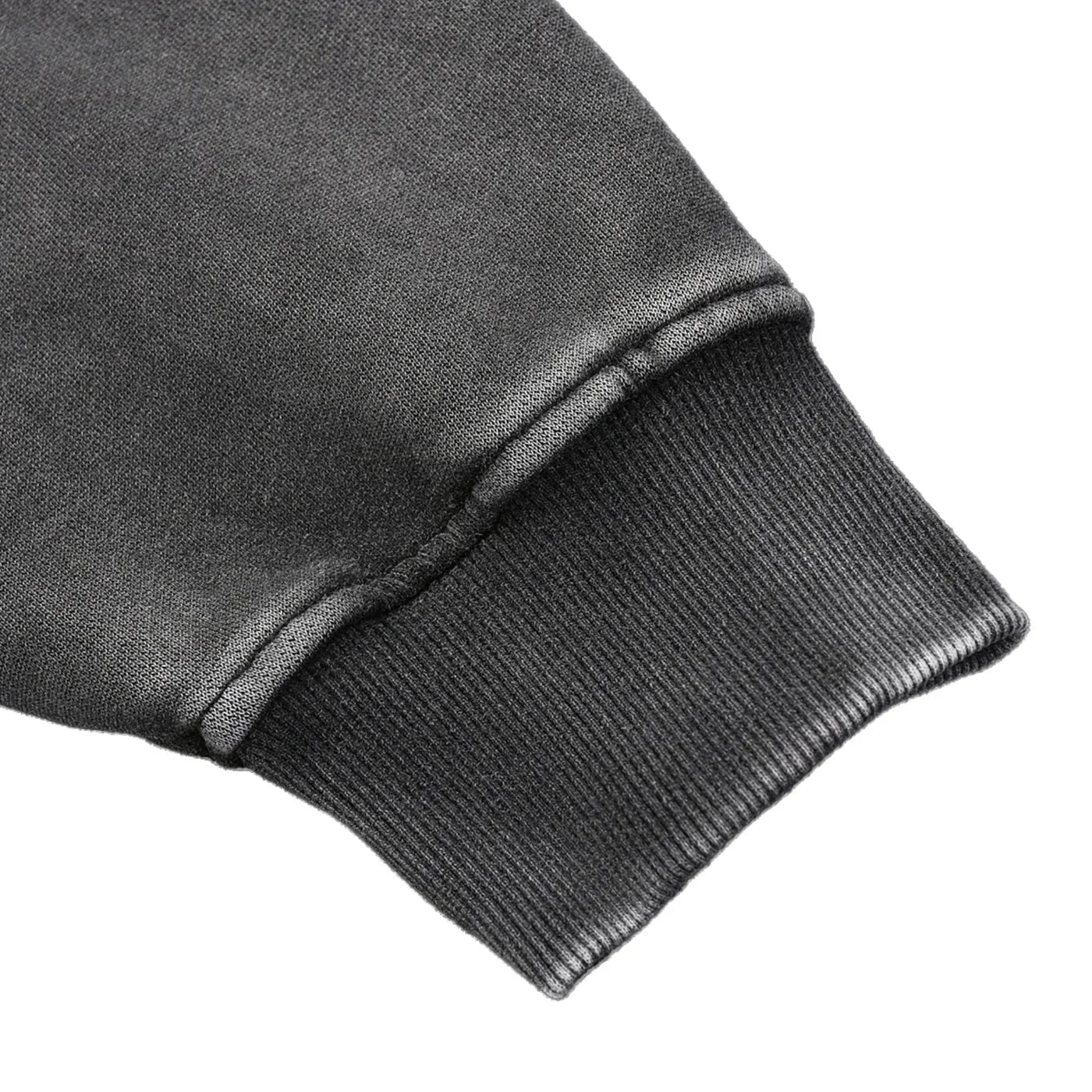 Close-up of a dark gray sweatshirt sleeve on a white background