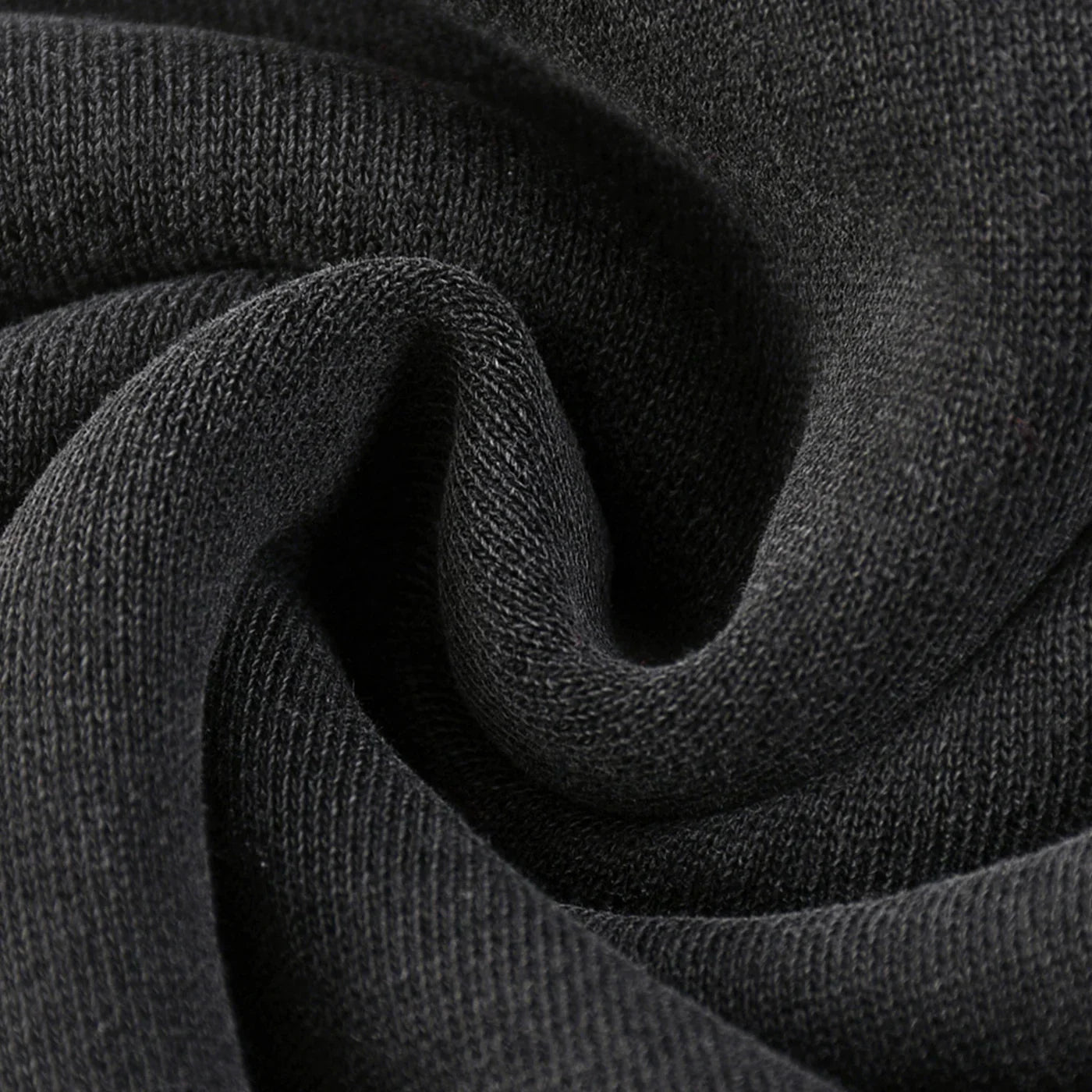 Close-up of dark gray fabric with a textured pattern